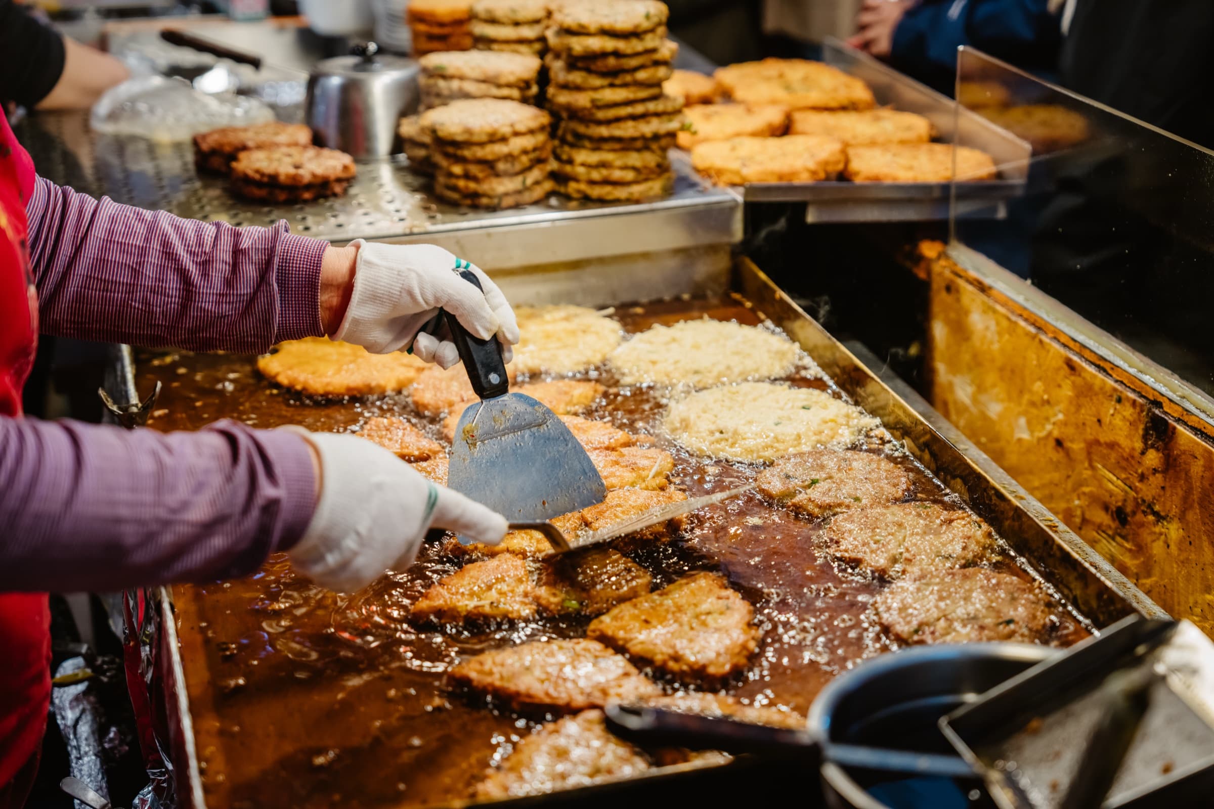 Korean street food frying at a local market stall